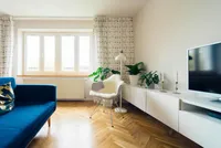 Comfortable living room with sofa and TV