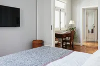 Bedroom with queen bed and wardrobe
